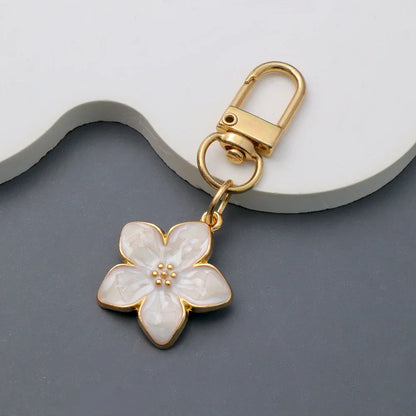 Lovely Enamel Sakura Keychain Mini Flower Keyring Handbag Pendants Car Key chain Jewelry Accessories Earphone Case DIY Ornament